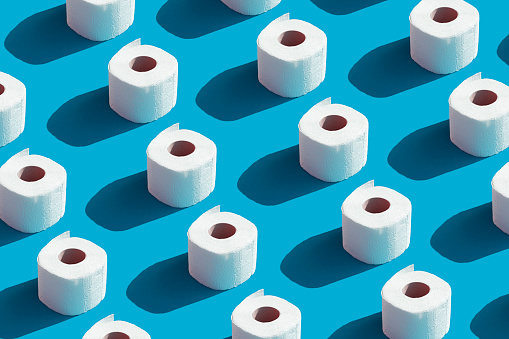 White roll toilet paper on the  blue background