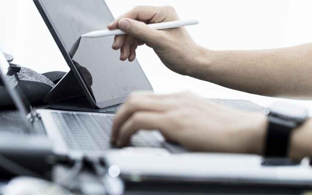 Free hands using laptop and tablet image, public domain CC0 photo.